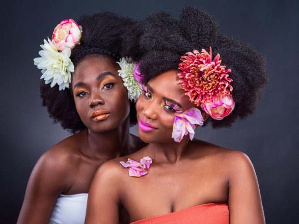47974682 i hope you blossom like the flower you are two beautiful women posing together with flowers in their hair